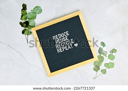 Letter board with quote Reduce Reuse Recycle and repeat with pepermint leaves. Environmental sustainable eco friendly, Zero waste concept Royalty-Free Stock Photo #2267721337