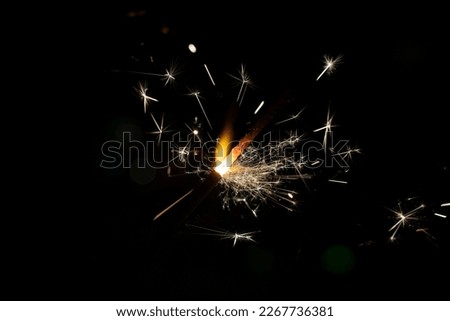 close up of sparkler on black background