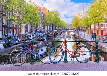 Amsterdam, Netherlands. Bicycles on a bridge early morning.