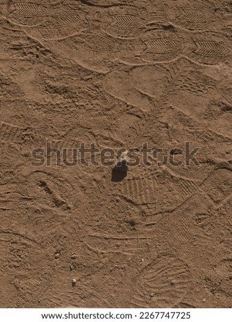 Stone in the stadium with red sand