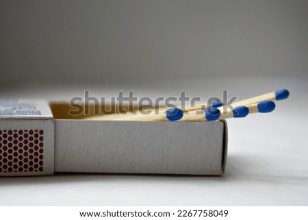 Matchsticks, blue matchsticks photographed close up. White background Royalty-Free Stock Photo #2267758049