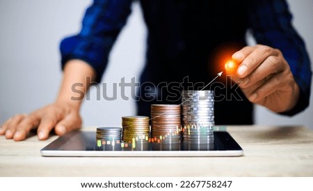 coin is placed as a graph showing the success of the income fund. Business success concept, wealth, investment, stock in the digital age. Digital transformation for next-generation technology. Royalty-Free Stock Photo #2267758247