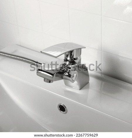 
basin faucet on hand basin