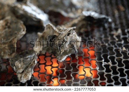 Grilled fresh oyster in Tainan, Taiwan, the famous Taiwanese street food gourmet.