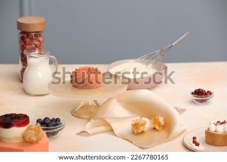 Beautiful composition of delicious desserts on beige table indoors. Food stylist