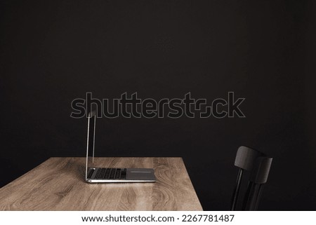 New modern laptop on empty wooden table indoors, space for text