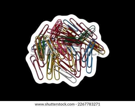 pile of colorful paper clips with black background
