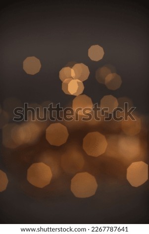 Golden glitter falling sparkle background on black with side copy space Royalty-Free Stock Photo #2267787641