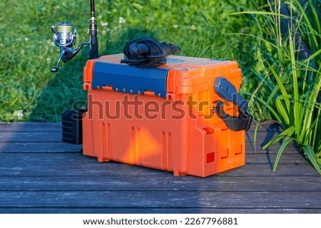 A large fisherman's tackle box fully stocked with lures and gear for fishing.fishing lures and accessories.Fishing tackle - fishing spinning.  Royalty-Free Stock Photo #2267796881