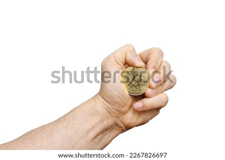 the hand tightly grips the Bitcoin cryptocurrency on a white background