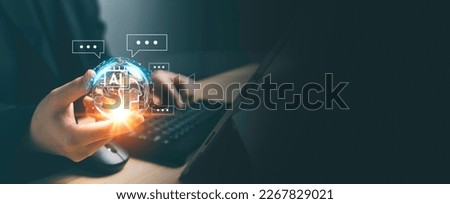 Chatbot Chat AI concept, Artificial Intelligence. Businessman using technology smart AI robot, enter command prompt, analyze data for business, Automate chatbot, Futuristic technology transformation. Royalty-Free Stock Photo #2267829021