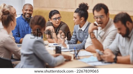 Around the boardroom table. Cropped shot of a large group of corporate businesspeople sitting around a table in the boardroom during a meeting. Royalty-Free Stock Photo #2267839065