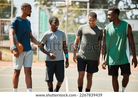 Team walking, basketball and conversation on sports court for fitness, healthy exercise workout and wellness training. Teamwork motivation, relax collaboration and group of people on basketball court
