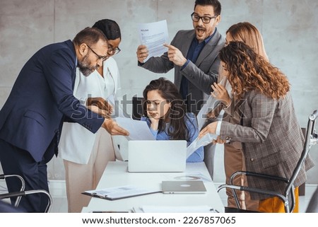 Shot of a young businesswoman looking anxious in a demanding office environment. Frustrated millennial female worker felling tired of working quarreling. Felling tired of working quarreling  Royalty-Free Stock Photo #2267857065