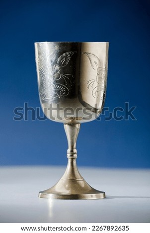 christian chalice on altar blue background blue background Royalty-Free Stock Photo #2267892635