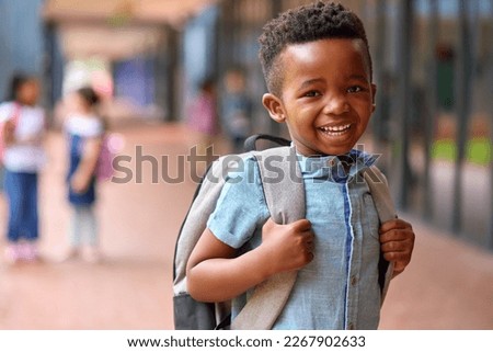 Portrait Of Smiling Male Elementary School Pupil Outdoors With Backpack At School Royalty-Free Stock Photo #2267902633