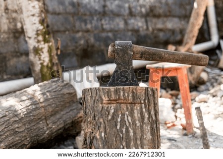 ax chopping on wood in the patio of a house