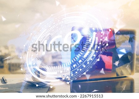 Double exposure of blockchain theme hologram and table with computer background. Concept of bitcoin crypto currency.