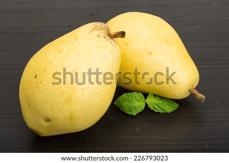 Bright ripe Yellow pears with mint leaves