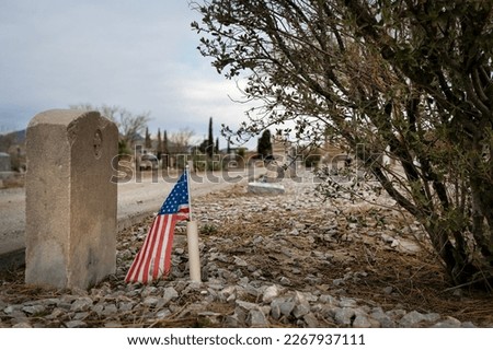 An American flag on the grave of a veteran at Concordia Cemetery in El Paso, Texas.