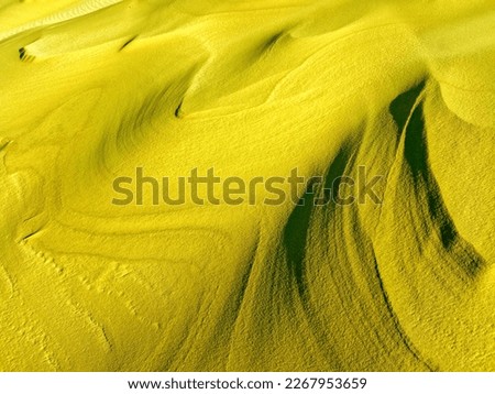 sand wavy texture as a background. sand of desert. yellow sea sand for designers