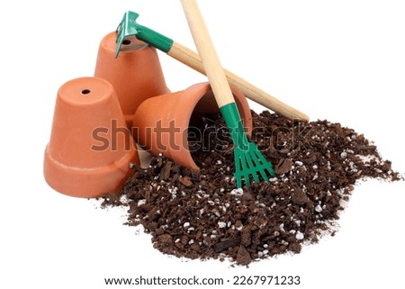 Clay pots, garden tools,and potting soil isolated on white with copy space,
 Royalty-Free Stock Photo #2267971233