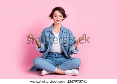 Full length photo of sweet charming lady dressed denim jacket closed eyes enjoying yoga isolated pink color background
