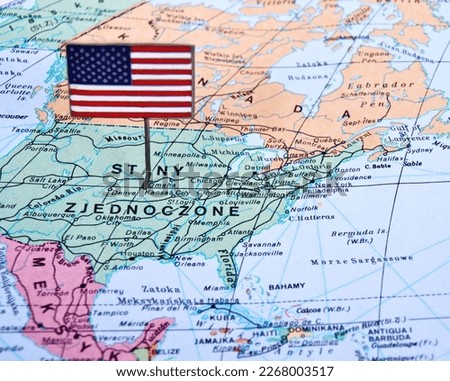 Macro close-up image of an unidentified map of the United States of America in color with surrounding borders