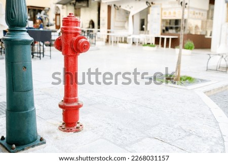 Red fire hydrant within the city. Fire hydrant for emergency fire access