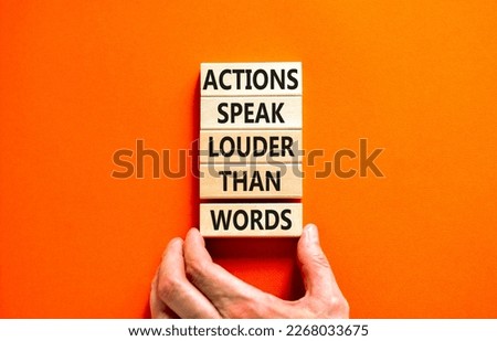 Actions speak louder words symbol. Concept words Actions speak louder than words on wooden blocks. Beautiful orange table orange background. Business new mindset for results concept. Copy space.