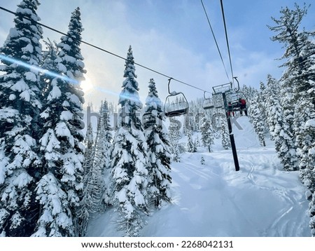 Beautiful chair lift ride up Palisades Tahoe in California Royalty-Free Stock Photo #2268042131