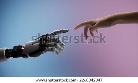 Silhouette of female hand touching the hand of a robot on a colorful background  Royalty-Free Stock Photo #2268042347