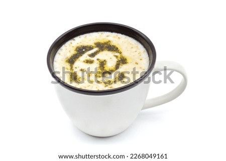 Traditional Turkish "yayla" soup with yoghurt and rice in a porcelain mug, isolated on white background