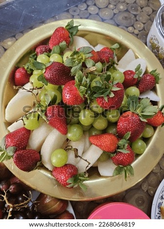 Pictures of fruits plated during a family gathering.
