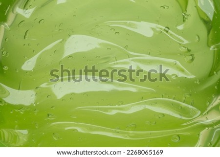 Green aloe vera gel in jar