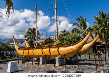 Traditional polynesian outrigger canoe in Papeete, near the Parc Paofai Royalty-Free Stock Photo #2268070689