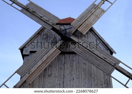 A historic wooden mill in the countryside, for the production of flour.