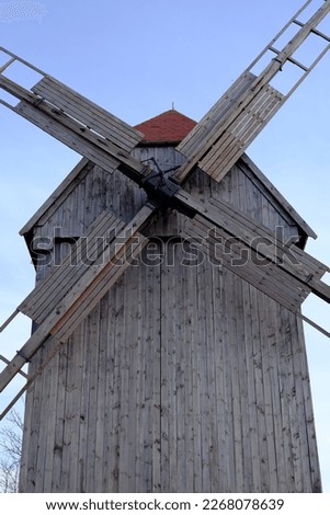 A historic wooden mill in the countryside, for the production of flour.