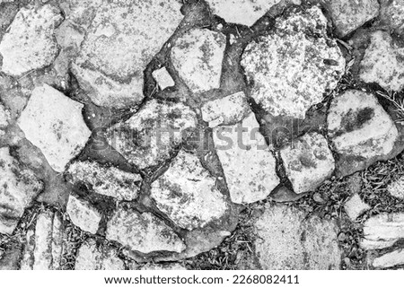 Pedestrian street from large stones, top view. Old pavement for publication, design, poster, calendar, post, screensaver, wallpaper, postcard, banner, cover, website. High quality photography