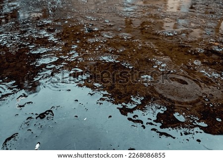 The background is water on the ground or rainwater. floating water. Rainwater Texture Background. rainwater and grace of god photo concept