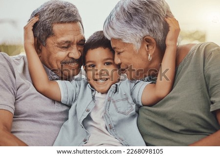 Family, portrait and child with grandparents in a living room, hug and happy, love and sweet while bonding in their home. Embrace, grandchild and grandmother with grandfather in a lounge hugging Royalty-Free Stock Photo #2268098105