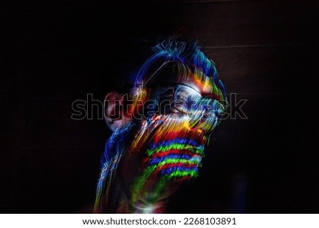 Artistic portrait made with fiber optics. Light painting photography. Day of light Art made with light.