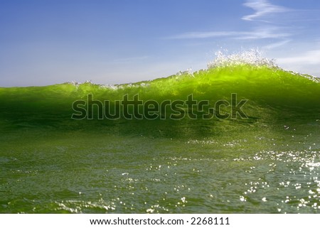 Green incident wave on a background of a blue sky