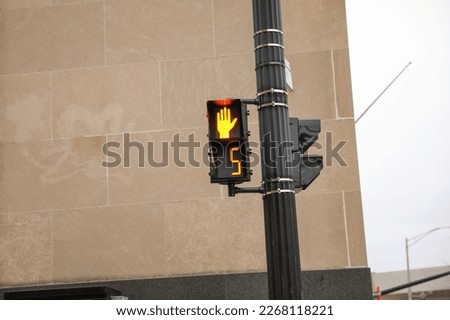 pedestrian walkway go and stop traffic signal in red and yellow