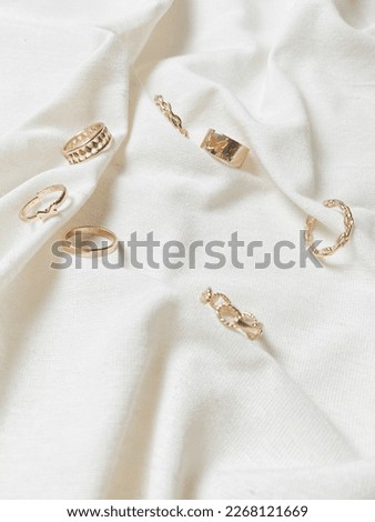 Rings with white canvas aesthetics flatlay background