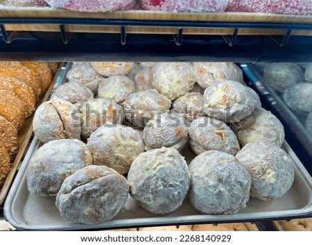 Traditional Mexican sweet bread known as yoyos or besos (yoyos or kisses)filled with jelly and coated with butter and sugar. Royalty-Free Stock Photo #2268140929