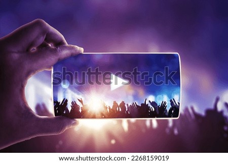 People hand holding their smart phones and photographing concert