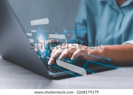 Businessman chatting on laptop with virtual artificial intelligence with chatbot communicate and interact helping business. Futuristic technology. Virtual assistant on internet. Royalty-Free Stock Photo #2268179179