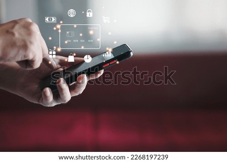 Hand holding credit card and using laptop. Businessman or entrepreneur working from home. Online shopping, e-commerce, internet banking, spending money, work from home concept.
 Royalty-Free Stock Photo #2268197239