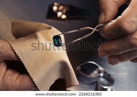 Professional jeweler working with gemstone, closeup view Royalty-Free Stock Photo #2268216383